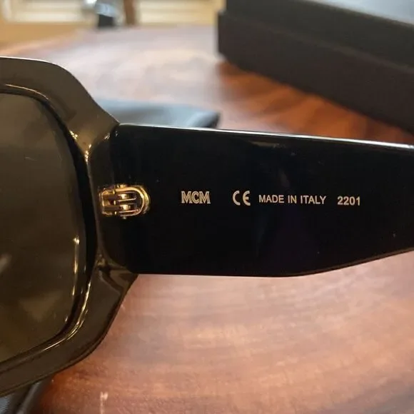 MCM NEW MCM 709S 002 Black Sunglasses With Anniversary Print On Temple